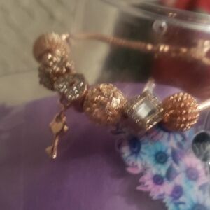 Elegant Gold and Silver Charm Bracelet